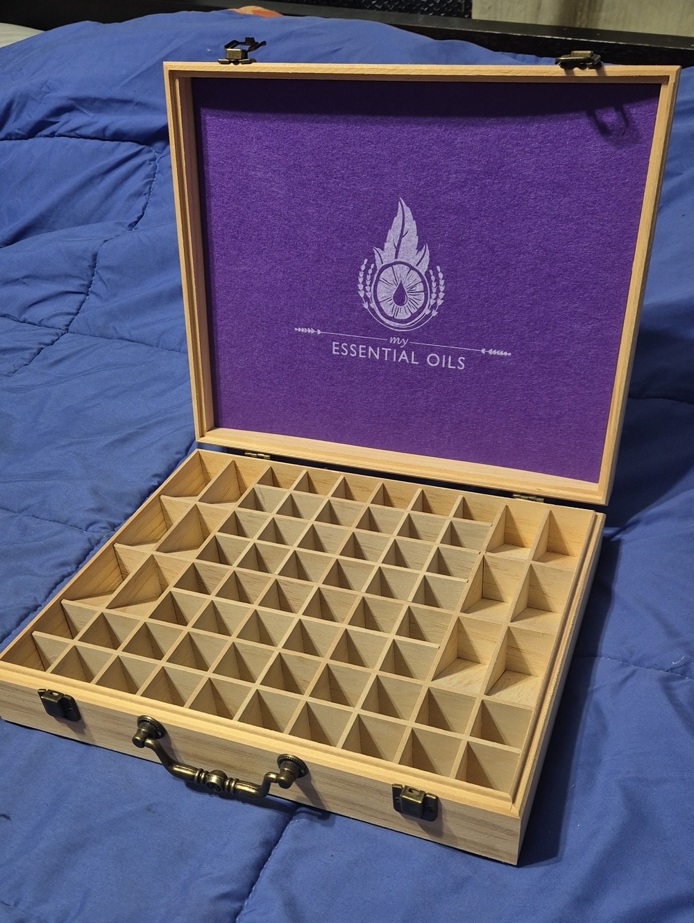 ​Wooden essential oils storage box with laser-engraved logo. Light natural wood